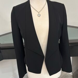 Calvin Klein in short jacket.